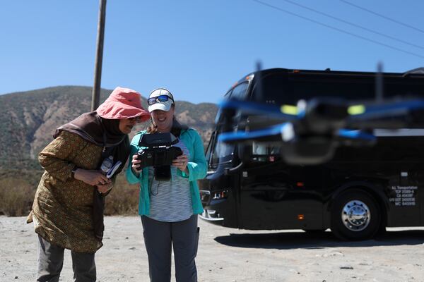 Bushra Hussaini, who works at the American Museum of Natural History, stands with Anita Marshall, a geoscience researcher at the University of Florida, as they operate a drone used to help others survey the San Andreas Fault during an accessible field trip organized by the International Association of Geoscience Diversity Thursday, Sept. 26, 2024, in San Bernadino, Calif. (AP Photo/Ryan Sun)