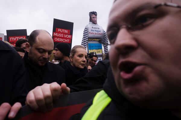 Yulia Navalnaya, center, with Russian opposition politician Vladimir Kara-Murza, left, lead a demonstration under the slogan "Stop Putin! Stop the War! Freedom for Political Prisoners!" in Berlin, Germany, Sunday, Nov. 17, 2024. (AP Photo/Markus Schreiber)