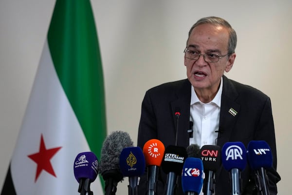 The President of the National Coalition of Syrian Revolution and opposition, Hadi Al-Bahra, speaks to the media during a press conference in Istanbul, Turkey, Monday, Dec. 2, 2024. (AP Photo/Khalil Hamra)