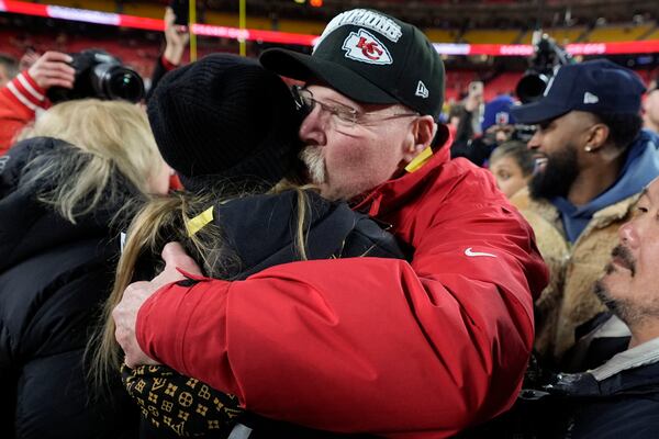 Taylor Swift embraces Kansas City Chiefs head coach Andy Reid after the AFC Championship NFL football game against the Buffalo Bills, Sunday, Jan. 26, 2025, in Kansas City, Mo. (AP Photo/Ashley Landis)