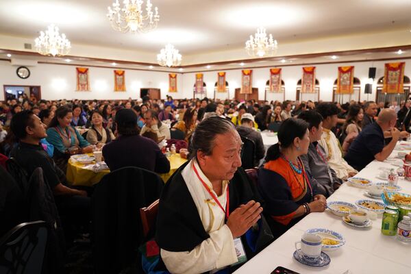 Hundreds attend the 18th birthday and enthronement ceremony for U.S.-born Buddhist lama, Jalue Dorje, at the Tibetan American Foundation of Minnesota in Isanti, Minn., on Saturday, Nov. 9, 2024. (AP Photo/Jessie Wardarski)