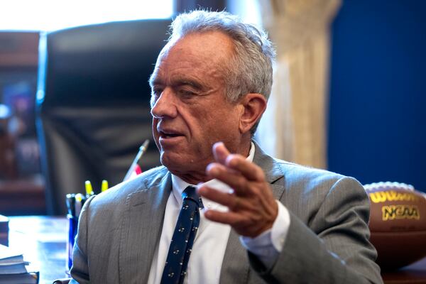 Robert Kennedy Jr., President-elect Donald Trump's pick to lead the Health and Human Services Department, meets with Sen. Tommy Tuberville, R-Ala., on Capitol Hill, Tuesday, Dec. 17, 2024, in Washington. (AP Photo/Mark Schiefelbein)