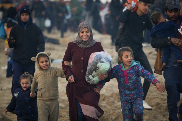 Displaced Palestinians return to their homes in the northern Gaza Strip, following Israel's decision to allow thousands of them to go back for the first time since the early weeks of the 15-month war with Hamas, Monday, Jan. 27, 2025. (AP Photo/Abdel Kareem Hana)