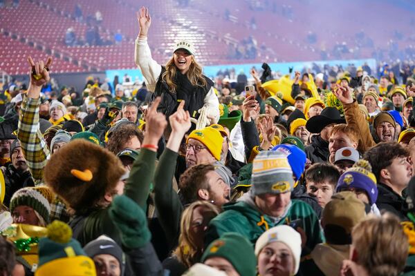 Supporters of North Dakota State react on the field following the FCS Championship NCAA college football game against Montana State, Monday, Jan. 6, 2025, in Frisco, Texas. North Dakota State won 35-32. (AP Photo/Julio Cortez)