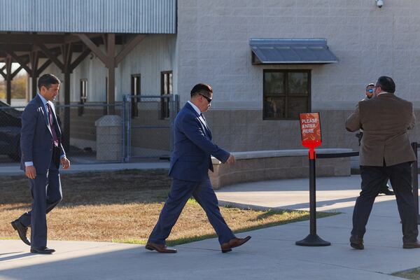 Former school district police officer Adrian Gonzales, center, and his legal team walk into the Uvalde County Justice Center , Thursday morning, Dec. 19, 2024, in Uvalde, Texas. (Sam Owens/The San Antonio Express-News via AP)