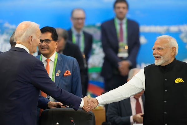 U.S. President Joe Biden, left, shakes hands with India's Prime Minister Narendra Modi during the G20 Summit leaders meeting in Rio de Janeiro, Monday, Nov. 18, 2024. (AP Photo/Eraldo Peres)