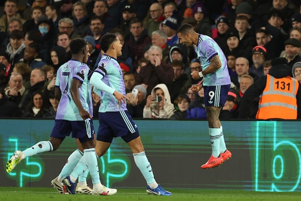 Arsenal's Gabriel Jesus, right, celebrates with his teammates after scoring his side's second goal during the English Premier League soccer match between Crystal Palace and Arsenal, at Selhurst Park, in Luton, England, Saturday, Dec. 21, 2024. (AP Photo/Ian Walton)