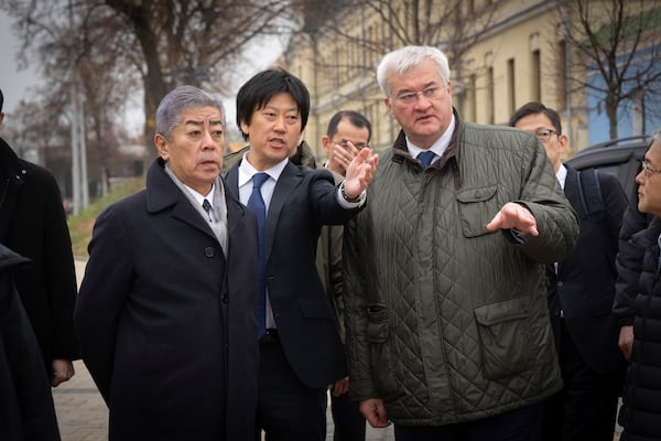 Japanese Foreign Minister Takeshi Iwaya, left, and Ukraine's Foreign Minister Andriiy Sybiha talk during their meeting in Kyiv, Ukraine, Saturday, Nov. 16, 2024. (AP Photo/Efrem Lukatsky)