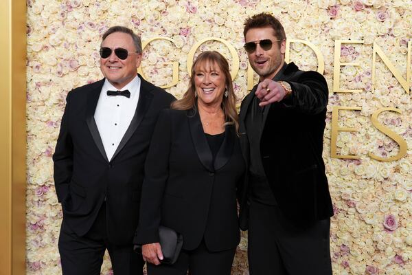 Glen Powell Sr., from left, Cyndy Powell, and Glen Powell arrive at the 82nd Golden Globes on Sunday, Jan. 5, 2025, at the Beverly Hilton in Beverly Hills, Calif. (Photo by Jordan Strauss/Invision/AP)