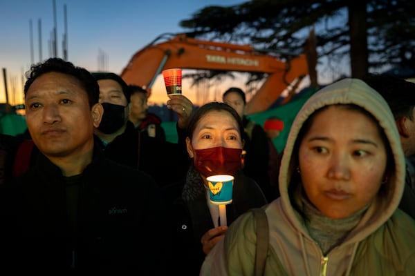 Exiled Tibetans participate in a candlelit vigil in Dharamshala, India, Wednesday, Jan. 8, 2025, in solidarity with the victims of an earthquake that hit a high-altitude Tibet region in western China on Tuesday. (AP Photo/Ashwini Bhatia)