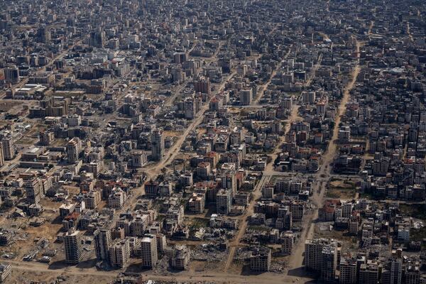 FILE - Destroyed buildings are seen from an U.S. Air Force plane flying over the Gaza Strip, on March 14, 2024. (AP Photo/Leo Correa, File)