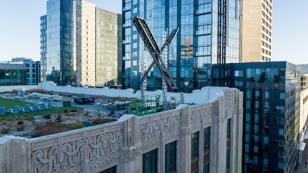 FILE - An "X" sign rests atop the company's headquarters in downtown San Francisco on July 28, 2023. (AP Photo/Noah Berger, File)