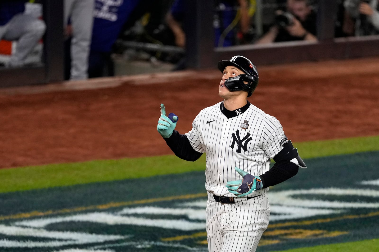 New York Yankees' Aaron Judge celebrates after hitting a two-run home run against the Los Angeles Dodgers during the first inning in Game 5 of the baseball World Series, Wednesday, Oct. 30, 2024, in New York. (AP Photo/Seth Wenig)