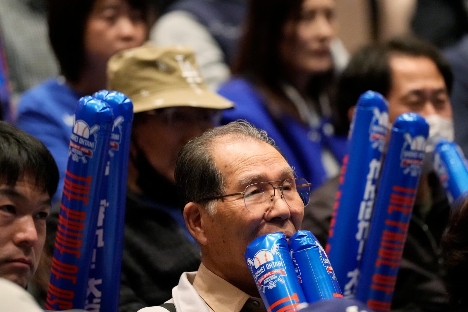 People watch a live stream before the start of Game 3 of the baseball World Series between the Los Angeles Dodgers and the New York Yankees during a public viewing event in Oshu, northeastern Japan, the hometown of Shohei Ohtani of the Dodgers, Tuesday, Oct. 29, 2024. (AP Photo/Eugene Hoshiko)