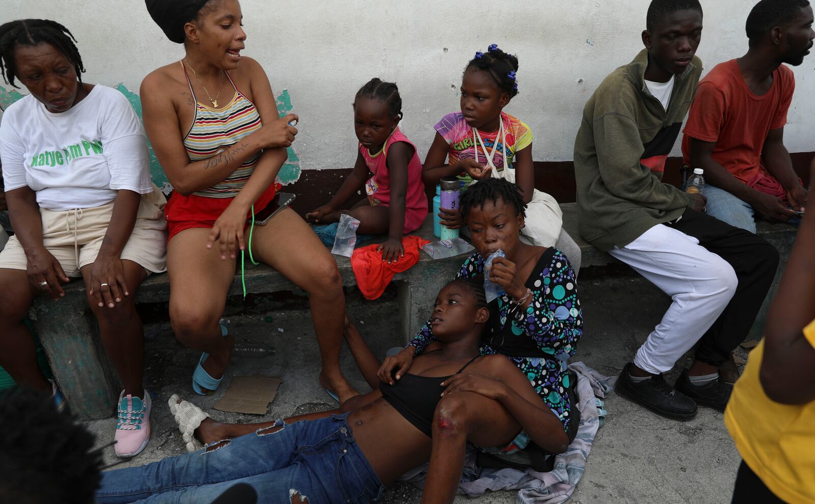 An asthmatic girl rests as she takes refuge in a private school serving as a shelter for residents fleeing gang violence in the Nazon neighborhood, in Port-au-Prince, Haiti, Thursday, Nov. 14, 2024. (AP Photo/Odelyn Joseph)