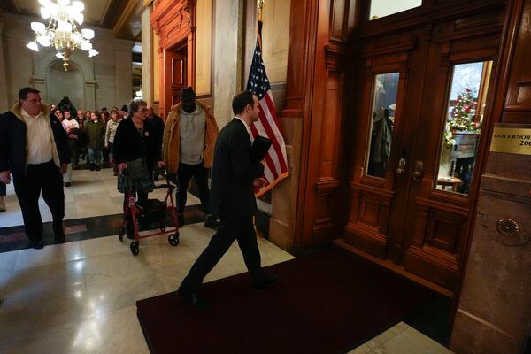 David Frank walks into the governors office during a gathering of the Indiana Abolition Coalition at the Statehouse, Thursday, Dec. 12, 2024, in Indianapolis. (AP Photo/Darron Cummings)