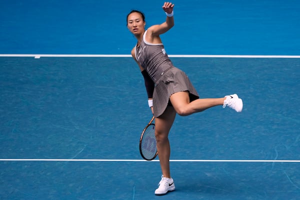 Zheng Qinwen of China reacts during her second round match against Laura Siegemund of Germany at the Australian Open tennis championship in Melbourne, Australia, Wednesday, Jan. 15, 2025. (AP Photo/Asanka Brendon Ratnayake)