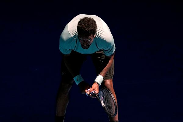 Gael Monfils of France waits to receive serve from Taylor Fritz of the U.S. during their third round match at the Australian Open tennis championship in Melbourne, Australia, Saturday, Jan. 18, 2025. (AP Photo/Manish Swarup)