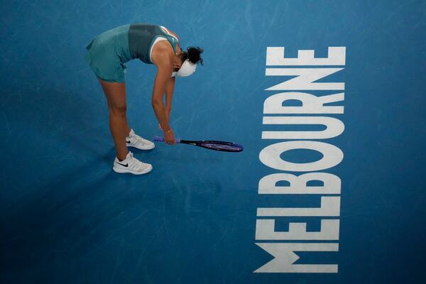 Madison Keys of the U.S. reacts during her semifinal match against Iga Swiatek of Poland at the Australian Open tennis championship in Melbourne, Australia, Thursday, Jan. 23, 2025. (AP Photo/Manish Swarup)