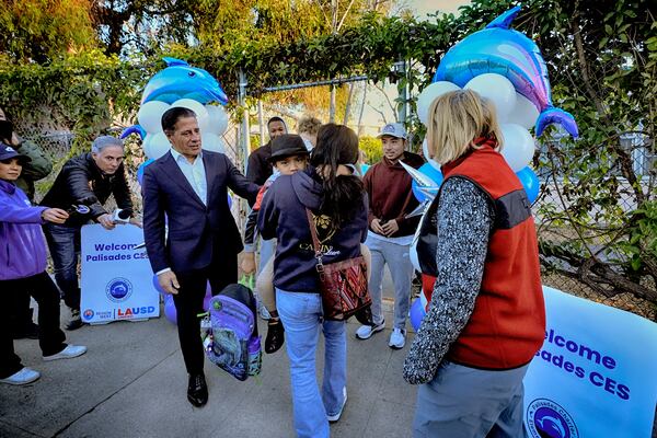 Los Angeles Unified Superintendent Alberto M. Carvalho greets students from Palisades Charter Elementary School upon their arrival at the Brentwood Elementary Science Magnet school in the Brentwood section of Los Angeles on Wednesday, Jan. 15, 2025. (AP Photo/Richard Vogel)