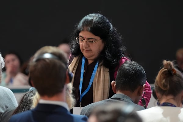 Chandni Raina, part of India's negotiating team, leaves a closing plenary session at the COP29 U.N. Climate Summit, Sunday, Nov. 24, 2024, in Baku, Azerbaijan. (AP Photo/Joshua A. Bickel)