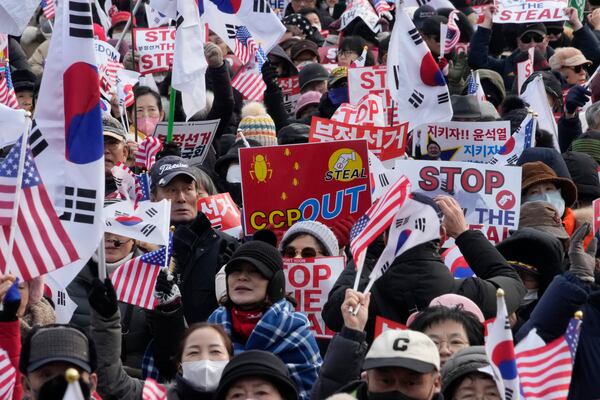 Supporters of impeached South Korean President Yoon Suk Yeol attend a rally to oppose his impeachment near the presidential residence in Seoul, South Korea, Wednesday, Jan. 8, 2025. (AP Photo/Ahn Young-joon)