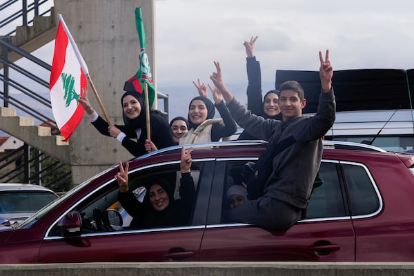 Displaced residents celebrate as they return to their villages following a ceasefire between Israel and Hezbollah that went into effect on Wednesday, Nov. 27, 2024, in Ablah, eastern Lebanon. (AP Photo/Hassan Ammar)