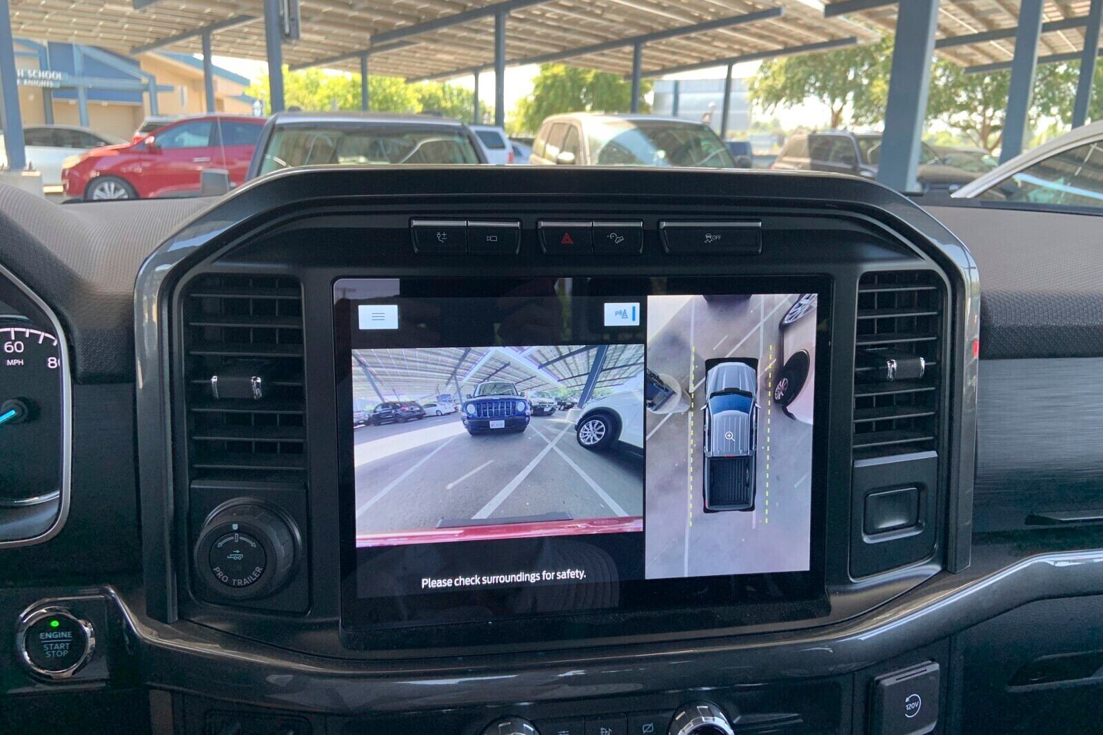 This photo provided by Edmunds shows a surround-view camera display in a Ford F-150. Multiple camera views are stitched together to create a virtual top-down view that makes parking much easier. (Courtesy of Edmunds via AP)