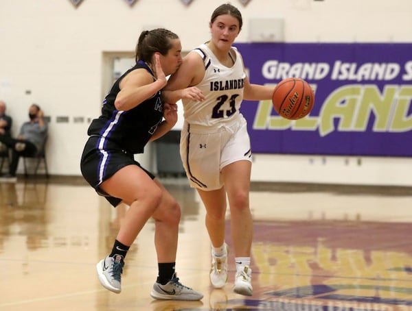 Grand Island High School's Hailey Kenkel (23) dribbles during a girls high school basketball game in Grand Island, Neb. (Josh Salmon/The Independent via AP)