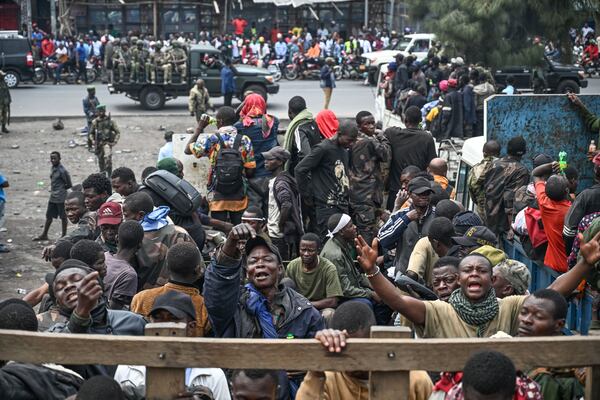 M23 rebels escort government soldiers and police who surrendered to an undisclosed location in Goma, Democratic republic of the Congo, Thursday, Jan. 30, 2025. (AP Photo/Moses Sawasawa)