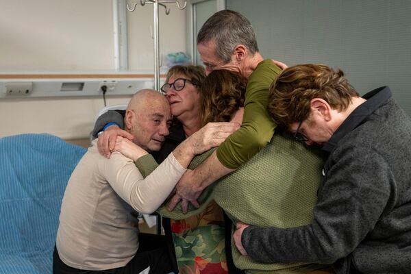 FILE - Luis Har, left, hugs his relatives after being rescued from captivity in the Gaza Strip, in Ramat Gan, Israel, on Feb. 12, 2024. (Israeli Army via AP)