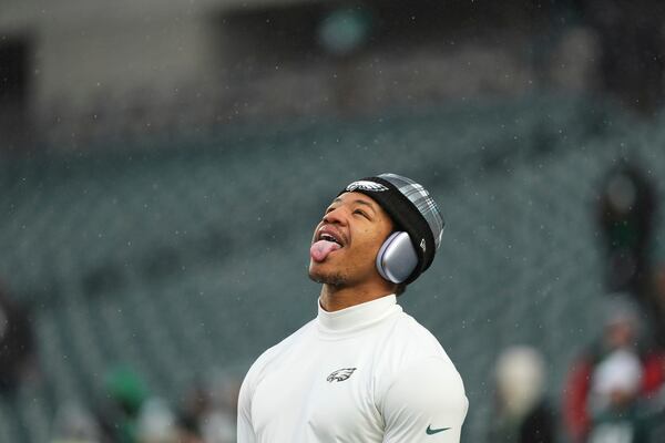 Philadelphia Eagles linebacker Nolan Smith Jr. sticks his tongue out as it snows before an NFL football NFC divisional playoff game against the Los Angeles Rams on Sunday, Jan. 19, 2025, in Philadelphia. (AP Photo/Matt Slocum)