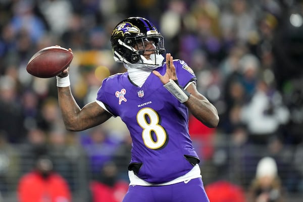 Baltimore Ravens quarterback Lamar Jackson throws a pass against the Pittsburgh Steelers during the first half of an NFL football game, Saturday, Dec. 21, 2024, in Baltimore. (AP Photo/Stephanie Scarbrough)