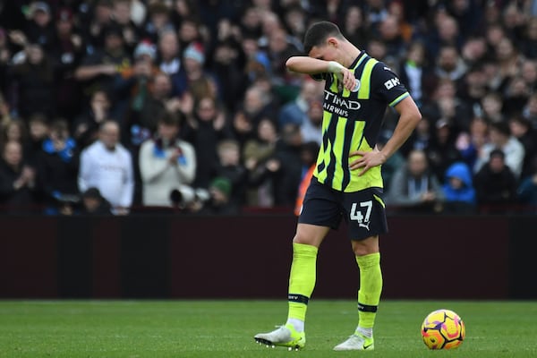 Manchester City's Phil Foden reacts after Aston Villa's Morgan Rogers scoring his side's second goal during the English Premier League soccer match between Aston Villa and Manchester City, at Villa Park in Birmingham, England, Saturday, Dec. 21, 2024. (AP Photo/Rui Vieira)