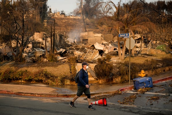 A property is destroyed by the Palisades Fire along Sunset Boulevard in the Pacific Palisades neighborhood of Los Angeles, Friday, Jan. 10, 2025. (AP Photo/John Locher)