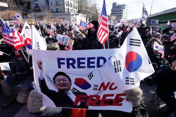 Supporters of impeached South Korean President Yoon Suk Yeol stage a rally to oppose his impeachment near the presidential residence in Seoul, South Korea, Thursday, Jan. 9, 2025. (AP Photo/Ahn Young-joon)