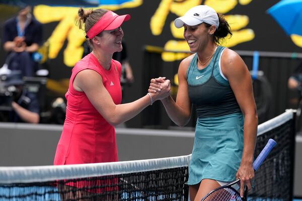 Madison Keys, right, of the U.S. is congratulated by Elina Svitolina of Ukraine following their quarterfinal match at the Australian Open tennis championship in Melbourne, Australia, Wednesday, Jan. 22, 2025. (AP Photo/Manish Swarup)