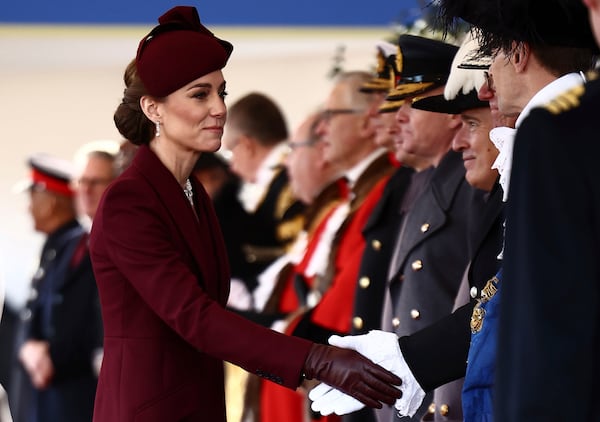 Britain's Kate, Princess of Wales arrives to welcome the Emir of the State of Qatar Sheikh Tamim bin Hamad Al Thani and Sheikha Jawaher bint Hamad bin Suhaim Al Thani in London, Tuesday, Dec. 3, 2024. (Henry Nicholls, Pool via AP)