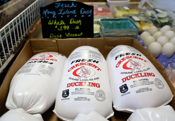 FILE - Whole ducklings, processed and packaged fresh that morning, sit in a cooler for sale at a retail store just over a mile away from their origin at Crescent Duck Farm, in Aquebogue, N.Y., Oct. 29, 2014. (AP Photo/Julie Jacobson, File)