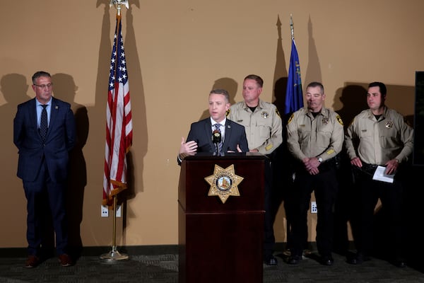 Spencer Evans, special agent in charge of the FBI's Las Vegas division, speaks at Metropolitan Police Department headquarters in Las Vegas Tuesday, Jan. 7, 2025, regarding a Tesla Cybertruck that exploded at the Trump International Hotel. Looking on from left are Bureau of Alcohol, Tobacco, Firearms and Explosives Special Agent in Charge San Francisco Division Kenny Cooper, Sheriff Kevin McMahill, Undersheriff Andrew Walsh and Assistant Sheriff Dori Koren. (K.M. Cannon/Las Vegas Review-Journal via AP)