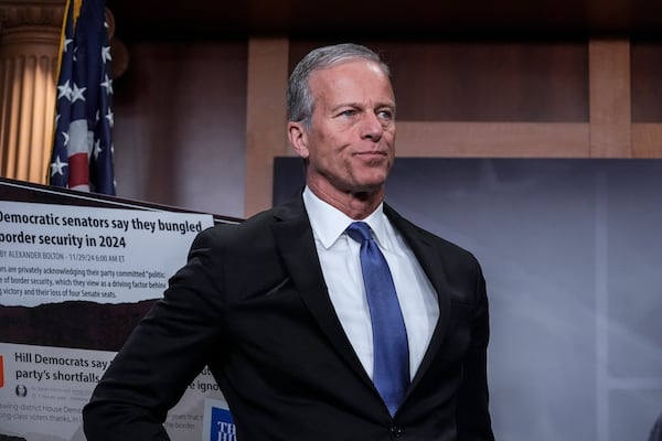 Senate Majority Leader John Thune, R-S.D., listens as Republican senators talk to reporters about the Laken Riley Act, a bill to detain unauthorized immigrants who have been accused of certain crimes, at the Capitol in Washington, Thursday, Jan. 9, 2025. Georgia nursing student Laken Riley was killed last year by a Venezuelan man who entered the U.S. illegally and was allowed to stay to pursue his immigration case. (AP Photo/J. Scott Applewhite)