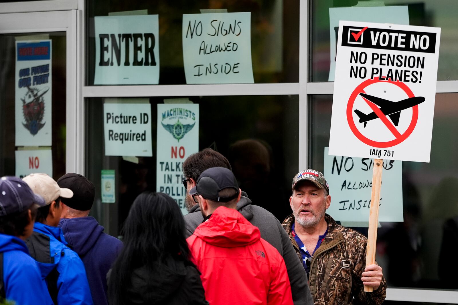 Bartley Stokes Sr., who has worked for Boeing for 46 years, encourages other employees on strike to vote no on a new contract offer from the company Wednesday, Oct. 23, 2024, at a voting location in the Angel of the Winds Arena in Everett, Wash. (AP Photo/Lindsey Wasson)