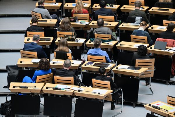 Members of parliament from the Green partiy turn their backs to the speaker during a speech by Berlin AfD MP Martin Trefzer, member of the Berlin House of Representatives, during the 60th plenary session of the Berlin House of Representatives, in Berlin, Thursday, Jan. 30, 2024. (Sebastian Christoph Gollnow/dpa via AP)