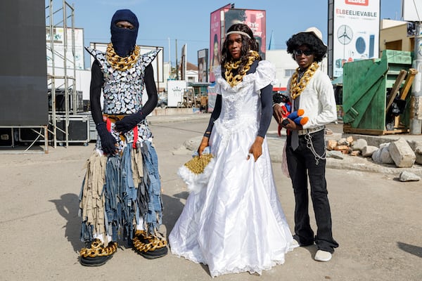 Attendees at a thrift and an upcycle show pose for a photograph in Accra, Ghana, Sunday, Oct. 27, 2024. (AP Photo/Misper Apawu)