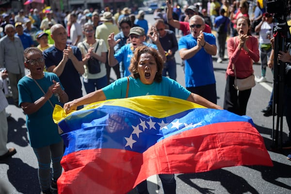 Opponents of Venezuelan President Nicolas Maduro protest the day before his inauguration for a third term in Caracas, Venezuela, Thursday, Jan. 9, 2025. (AP Photo/Matias Delacroix)