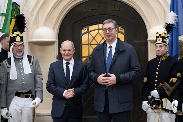 German Chancellor Olaf Scholz, center left, and Aleksandar Vucic, center right, President of Serbia, pose for a photo during their meeting in Freiberg, Germany, Tuesday, Dec. 10, 2024. (Sebastian Kahnert/DPA via AP, Pool)