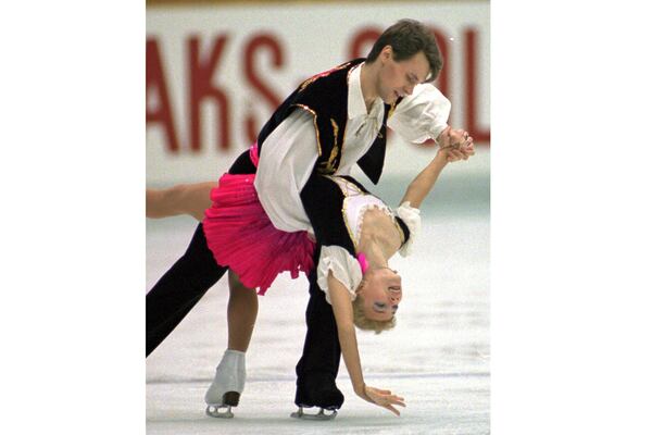 FILE - Evgenia Shishkova and Vadim Naumov of Russia perform during free skating in the pairs event of the NHK Trophy International Figure Skating Competition at Nagoya central Japan, Dec. 9, 1995. (AP Photo/Shizuo Kambayashi, File)