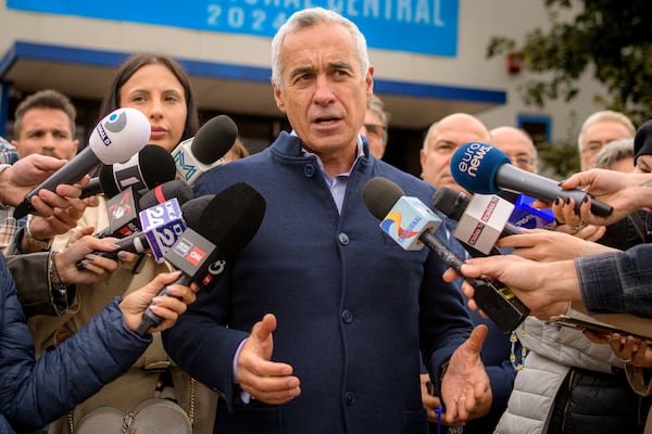 Calin Georgescu, running as an independent candidate for president, speaks to media after registering his bid in the country's presidential elections, in Bucharest, Romania, Tuesday, Oct. 1, 2024. (AP Photo/Alexandru Dobre)