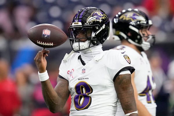 Baltimore Ravens quarterback Lamar Jackson warms up before an NFL football game against the Houston Texans, Wednesday, Dec. 25, 2024, in Houston. (AP Photo/David J. Phillip)