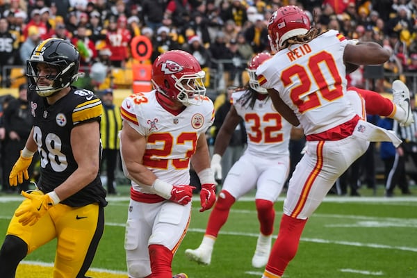 Kansas City Chiefs safety Justin Reid (20) intercepts the ball intended for Pittsburgh Steelers tight end Pat Freiermuth (88) during the first half of an NFL football game, Wednesday, Dec. 25, 2024, in Pittsburgh. (AP Photo/Gene J. Puskar)